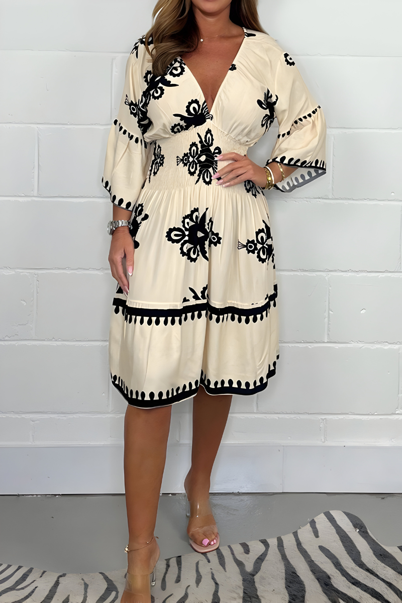 Elegante jurk met patroon en V-hals – perfect voor elke gelegenheid