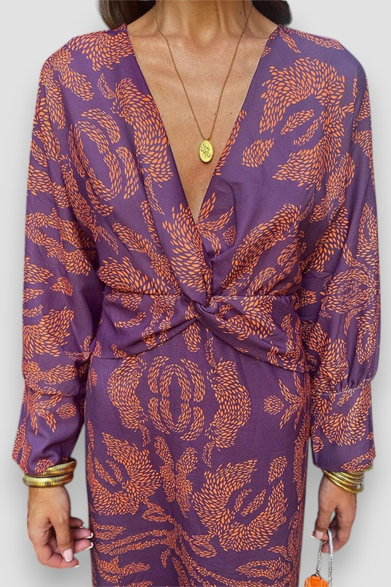 Elegante midi-jurk met twist-detail en bloemmotief – Tijdloos en stijlvol